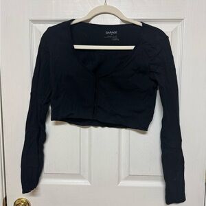 Black long sleeve top with slits in the middle